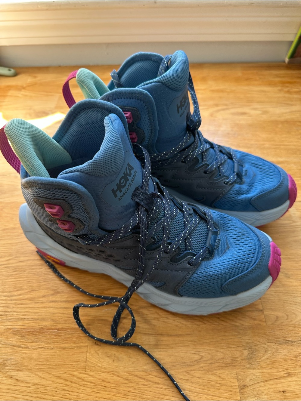 Hoka Women's Blue High-Top Trail Sneakers with Pink Accents